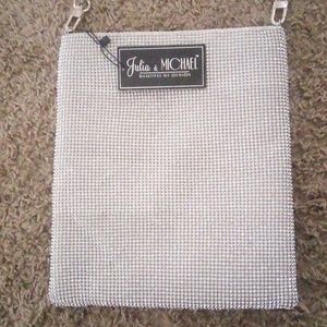 A brand new never used silver Julia and Michaels bag